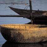 A small basket boat on the river at Hoi An.