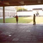 A grandfather gives a tai chi lesson to his granddaughter at the entrance to The Dr. Sun Yat-Sen Park.