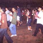 Amidst an impressive cloud of incense smoke, the faithful vien tien, or walk three times clockwise round the ordination hall (bot) or relic chamber (chedi).