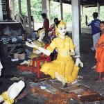Phimai, Thailand: Both monks and laymen construct the wax sculptures, which consist of a base of wood or plaster coated in beeswax of various hues, e.g. saffron and green. Multi-colored pins are inserted to resemble jewels. Paint is then applied to highlight faces and other features.