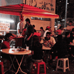 A stall where people sits by the roadside for their meals. This is one of those non-mamak stalls, handled by a Malay. Serves excellent nasi lemak.