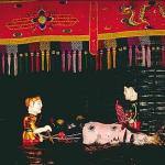 Who says that riding a buffalo is a hard knock life? The water buffalo is the omnipresent draft animal of the Vietnamese countryside. Boys grow up tending the animals, amusing themselves while seated on the buffalo's broad back in the cooling waters of a pond. The song evokes shared memories.