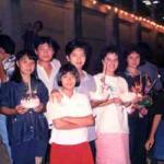 A group of Thais stand by the Mae Ping River in Chiang Mai, as they await the opportunity to launch their kratongs, shown here held in their hands.
