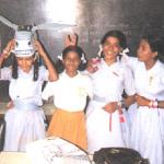 Bombay, India. Every year, Indian students dedicate much of a school day to exchanging ribbons of various colors, shown here tied around their wrists. Each color corresponds to some emotion (red is love, black is hate, etc.) that the giver feels for the receiver. Somewhere I still have the mass of ribbons I received that day, tied well up to the middle of my forearm.