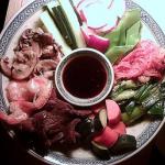 Grilled beef and shrimp, stir-fried mushrooms, fresh cucumber, radishes and snow peas, spicy kimchi, grilled scallions and homemade salt pickles. An assortment of fillings to be wrapped in thin, delicate pancakes and dipped in a savory soy-ginger-garlic sauce.