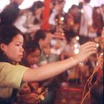 Making merit to the Pra Bang on the third day of the festival. The revered Pra Bang is brought out only at New Year.