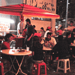 At the mamak stalls. Have your meal by the roadside.