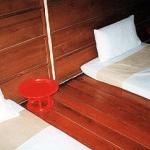 Chiang Mai, Thailand: A room in a typical massage parlor contains a number of thin mattresses, between which are /toke/s, or small tables. On the tables are cups of steaming Chinese tea. On the mattresses are sets of cotton pajamas for you to wear.