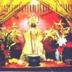 Matsu, the Chinese sea goddess, watches on benignly as the supplicants come and go.