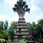 A statue in the Thai park representing the Buddha's pacification of vipers.
