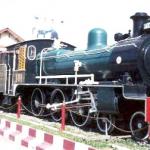 Picturesque old engine sits in front of the Phitsanulok Train Station.