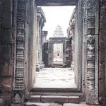 Phimai, Thailand: The outer wall is connected to the inner wall, or gallery, by a raised passageway, and even from this remove the central tower can be seen.