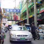 Narrow streets, with goods stacked up outside the shop...