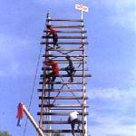 A team mounts their entry onto a rickety launch pad in preparation for the Bun Bang Fai festival in Yasothon, Thailand.