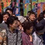 Although baseball has gained enormous popularity since its introduction to Japan, sumo wrestling still remains its national sport. Sumo fans turn out in droves to enjoy the six tournaments called basho held throughout the year. Here, a crowd waits for the sumo basho to begin.