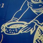 This mural shows the way water used to be delivered, with a smile as mischievously ambiguous as the Mona Lisa's. Chiang Mai, Thailand.