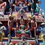 Details of the gopuram over the entrance of the temple. The five-tiered tower is crowded with figurative sculptures of gods, goddesses and beasts.