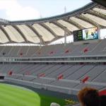 Here, you can see partial of the roof of the Seoul World Cup Stadium, which is shaped like a gigantic rectangular shield. This rectangular shield is built to resemble that of a traditional Korean kite. In Korea, kite symbolizes the spirit and culture of the country ? the intensity and hope of the Koreans to see their country unite as one and to attain world peace. If you look closely, you can see the pillars that support the roof. This brings about another meaning. The pillars are made to look like masts of sailing crafts known as Hwangpo Dotbae</i.. The Hwangpo Dotbae used to ply the Hangang River.